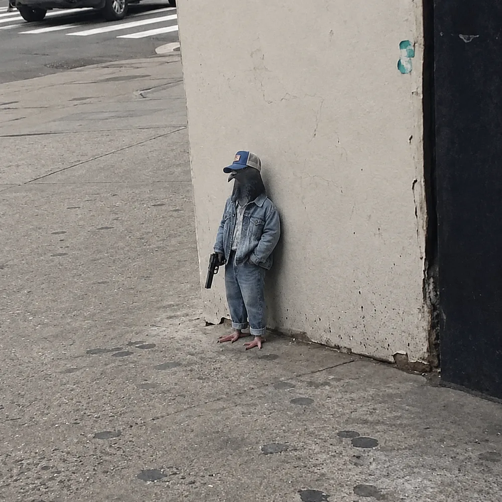 The pigeon leaning against the wall — double denim.
