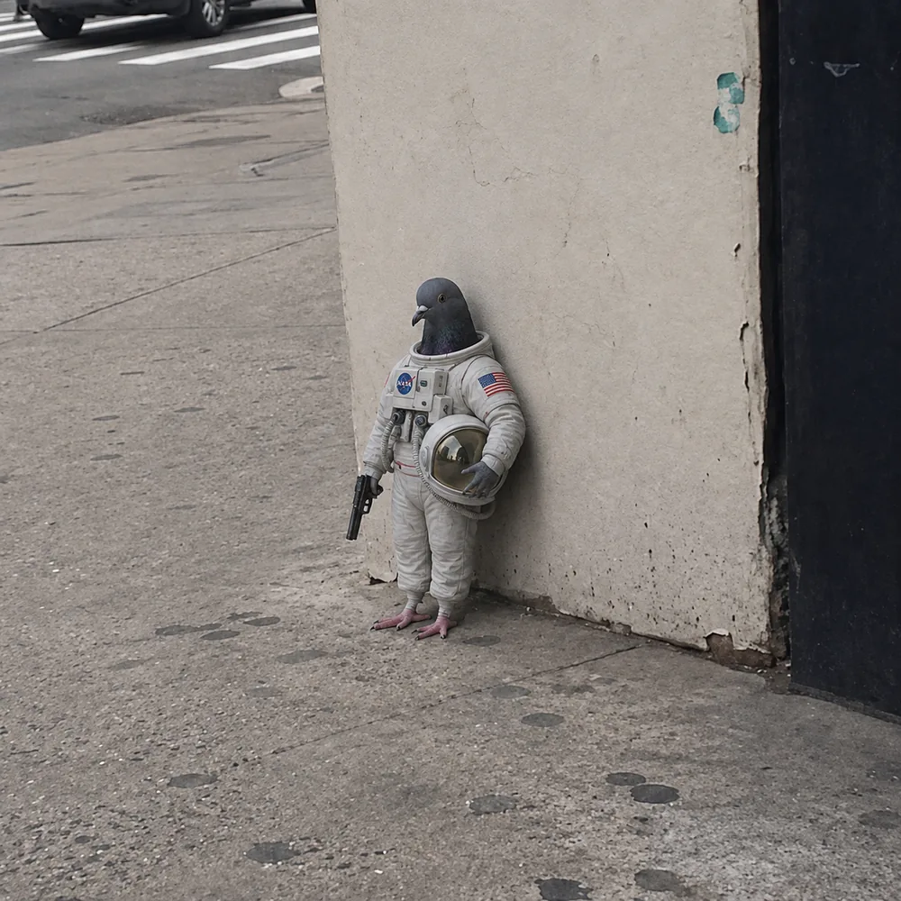 The pigeon leaning against the wall — pressure suit.